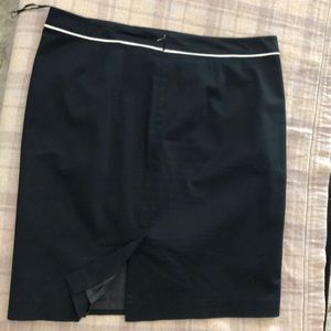 Black skirt with flattering detailing.